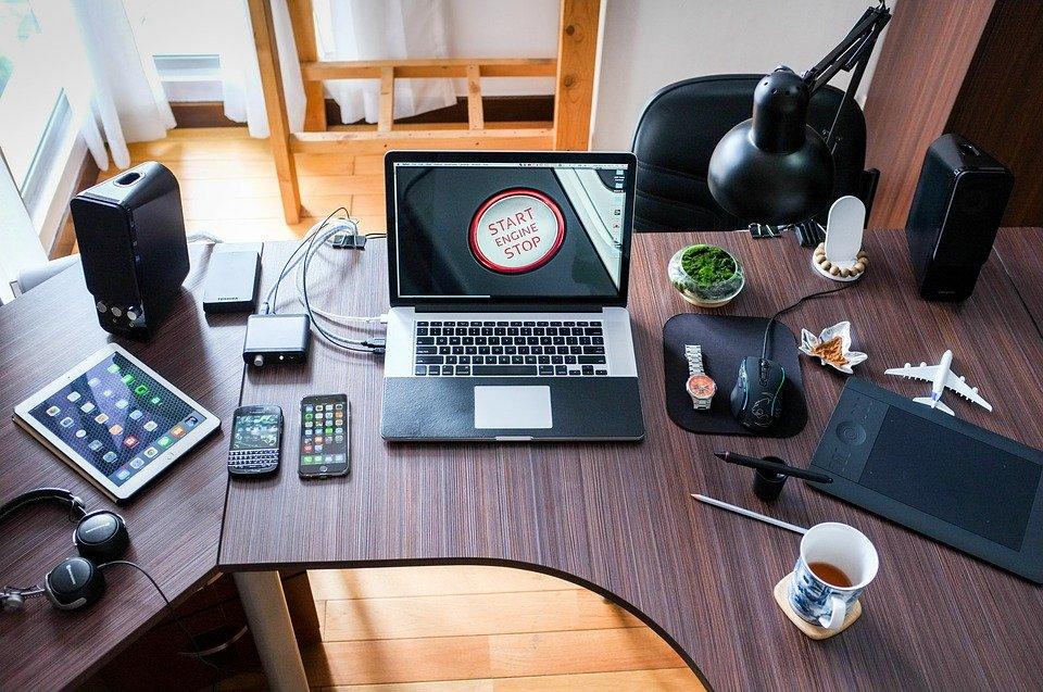 Reseller's desk with laptop, iPad, smartphones and accessories