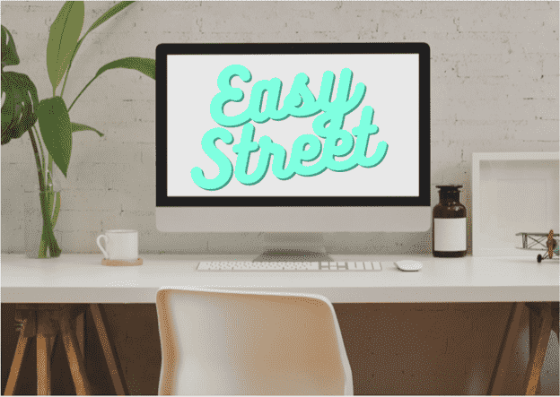 Desktop computer showing the words "Easy Street" on a white desk